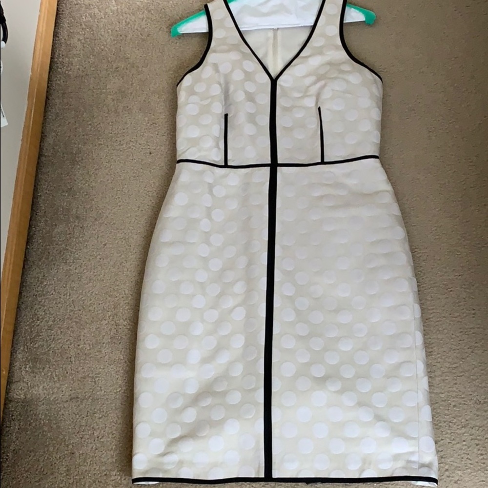 Tan and white polka dot with black piping dress